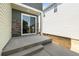 A covered patio with stone accents provides an inviting outdoor living space at 20871 E 60Th Ave, Aurora, CO 80019