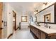 Bathroom with double sink vanity, freestanding tub, and separate shower at 6191 S Olathe St, Centennial, CO 80016
