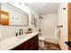 Bathroom featuring vanity with vessel sink, shower over tub, and tile flooring at 6191 S Olathe St, Centennial, CO 80016