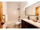 This bathroom features a tub and shower with a vanity sink at 6191 S Olathe St, Centennial, CO 80016