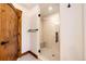 Bathroom featuring a glass enclosed shower with seating at 6191 S Olathe St, Centennial, CO 80016