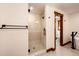 Bathroom featuring a glass enclosed shower and a separate bathtub at 6191 S Olathe St, Centennial, CO 80016