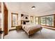 Bright bedroom with many windows, wood trim and neutral decor at 6191 S Olathe St, Centennial, CO 80016
