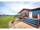 Charming home exterior showcases a well-manicured landscape and inviting front porch at 6191 S Olathe St, Centennial, CO 80016