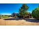 Ranch style home with a large tree in the front yard at 6191 S Olathe St, Centennial, CO 80016