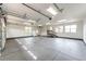 An oversized three car garage with stairs to the home interior at 6191 S Olathe St, Centennial, CO 80016