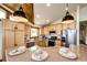 Modern kitchen featuring stainless steel appliances, granite countertops, and ample cabinet space at 6191 S Olathe St, Centennial, CO 80016