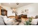 Bright living room with hardwood floors, stylish furniture, and a staircase leading to the upper level at 6191 S Olathe St, Centennial, CO 80016