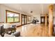 Bright living area with hardwood floors, large windows, and a comfortable seating arrangement at 6191 S Olathe St, Centennial, CO 80016