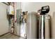 This utility room features a water heater and water softener at 6191 S Olathe St, Centennial, CO 80016