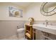 Cozy powder room with tile accents, a modern sink, and an ornate mirror at 1020 15Th St # 42A, Denver, CO 80202