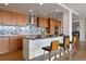 Modern kitchen features wood cabinets, stainless steel appliances, a center island, and granite countertops at 1020 15Th St # 42A, Denver, CO 80202
