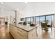 Bright, open kitchen with a large island, dining area, and city views at 1020 15Th St # 42A, Denver, CO 80202