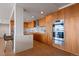 Modern kitchen featuring wood cabinets, stainless steel appliances and marble backsplash at 1020 15Th St # 42A, Denver, CO 80202