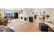 Open-concept living room with a fireplace, hardwood floors, and floor-to-ceiling windows showcasing city views at 1020 15Th St # 42A, Denver, CO 80202