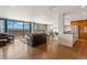 Bright and airy living room with floor-to-ceiling windows showcasing stunning mountain views at 1020 15Th St # 42A, Denver, CO 80202