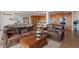 Living room showcases leather furniture and open access to a modern kitchen at 1020 15Th St # 42A, Denver, CO 80202