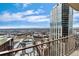 Breathtaking city view from the balcony of a modern high-rise condo against a cloudy sky at 1020 15Th St # 42A, Denver, CO 80202