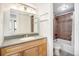 Cozy bathroom featuring a single sink vanity and tub/shower combo at 1020 15Th St # 15G, Denver, CO 80202