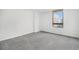 Bright bedroom offers gray carpeting and window views of the city at 1020 15Th St # 15G, Denver, CO 80202