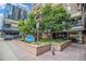 Building entrance with trees and signage at 1020 15Th St # 15G, Denver, CO 80202