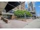 Building entrance with trees and sculpture at 1020 15Th St # 15G, Denver, CO 80202