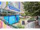 Outdoor event space with seating, a blue structure, and festive decor in an urban setting at 1020 15Th St # 15G, Denver, CO 80202