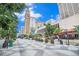 Scenic street view of Denver with landscaped sidewalks, tall buildings, and pedestrian activity at 1020 15Th St # 15G, Denver, CO 80202
