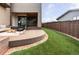 Curved deck with seating area and artificial turf at 9385 E 58Th Dr, Denver, CO 80238