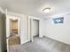 A finished basement area with new carpet, white walls, and a small closet at 945 W 8Th Avenue Dr, Broomfield, CO 80020