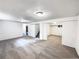Spacious basement featuring neutral carpet, white walls, and convenient sliding door access at 945 W 8Th Avenue Dr, Broomfield, CO 80020