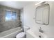 Contemporary bathroom featuring a tub-shower, modern fixtures, and sleek vanity at 945 W 8Th Avenue Dr, Broomfield, CO 80020