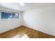 Bright bedroom featuring hardwood floors and a sunlit window at 945 W 8Th Avenue Dr, Broomfield, CO 80020