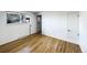 Bedroom featuring hardwood floors, a closet, and a bright window at 945 W 8Th Avenue Dr, Broomfield, CO 80020