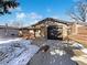 Charming single-story home featuring a brick facade, attached garage, and a cozy front porch at 945 W 8Th Avenue Dr, Broomfield, CO 80020