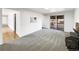 Large living room with carpet, fireplace, and slider to outdoor deck at 945 W 8Th Avenue Dr, Broomfield, CO 80020