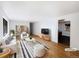 Bright living room with hardwood floors, white walls, and comfortable seating area at 945 W 8Th Avenue Dr, Broomfield, CO 80020