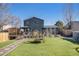 Expansive backyard with deck, gazebo, artificial grass, and landscaping at 17233 E Princeton Dr, Aurora, CO 80013