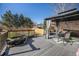 Backyard deck featuring a gazebo, patio furniture, and fish pond at 17233 E Princeton Dr, Aurora, CO 80013