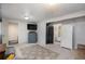 Finished basement area with a large living area and attached bathroom at 17233 E Princeton Dr, Aurora, CO 80013