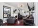 Charming living room boasting hardwood floors, a fireplace, and comfortable leather chairs at 17233 E Princeton Dr, Aurora, CO 80013