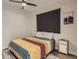 Cozy bedroom with modern ceiling fan, hardwood floors, and a large window for natural light at 4025 Jason St # 101, Denver, CO 80211