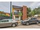 Modern two-story home featuring a brick facade and a small front balcony with a black metal railing at 4025 Jason St # 101, Denver, CO 80211