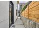 Contemporary home exterior featuring a private entrance and a modern design, showcasing clean lines and a welcoming pathway at 4025 Jason St # 101, Denver, CO 80211