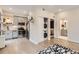 Modern kitchen featuring stainless steel appliances, gray cabinetry, and convenient in-unit laundry at 4025 Jason St # 101, Denver, CO 80211