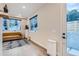 Bright living room space with natural light, hardwood floors, and seamless access to the outdoor patio at 4025 Jason St # 101, Denver, CO 80211