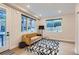 Bright living room with modern rug, hardwood floors, and large windows at 4025 Jason St # 101, Denver, CO 80211