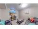 Finished basement includes sitting area and entertainment center at 7081 Warren Dr, Denver, CO 80221
