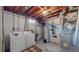 Basement laundry area equipped with washer, dryer, sink, and utility hookups at 7081 Warren Dr, Denver, CO 80221