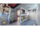 Basement features mechanicals, wood shelving, and open floorplan at 7081 Warren Dr, Denver, CO 80221